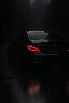 Close-up of Mercedes-Benz signature LED rear taillights glowing at night, aesthetic wallpaper for mobile.