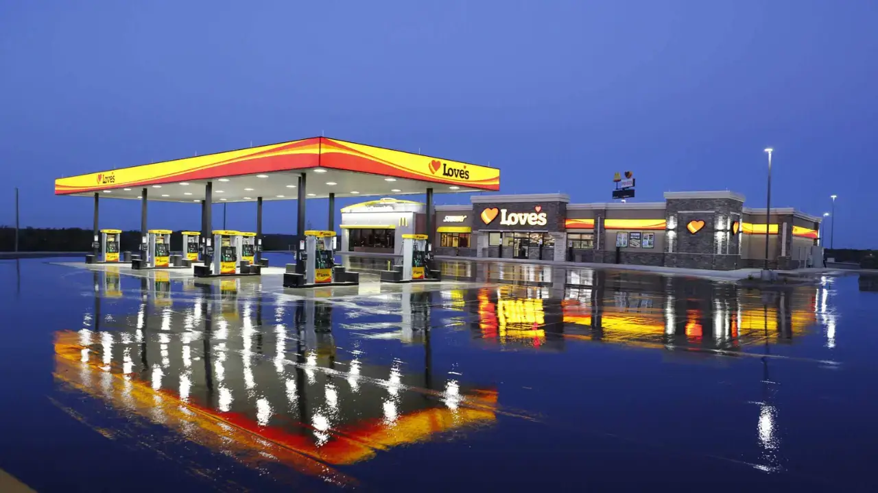 Love’s petrol pump and gas station at night with bright lights and fuel pumps in the USA
